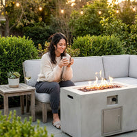 Concrete Outdoor Propane Fire Pit Table, 50,000 BTU Square Gas Fire Table with Adjustable Flame, Lava Rocks, Weather-Resistant Design, and Protective Cover for Patio, Deck, or Backyard — Lifestyle